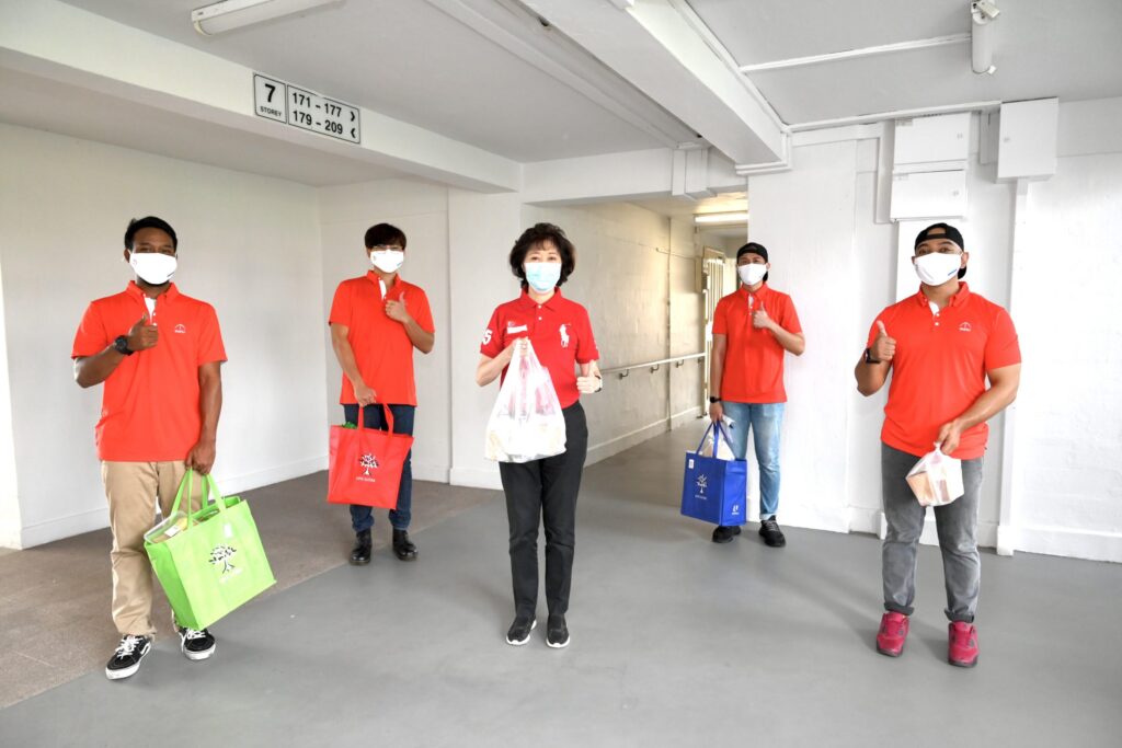 Sister Mary Liew pictured with SMOU volunteers