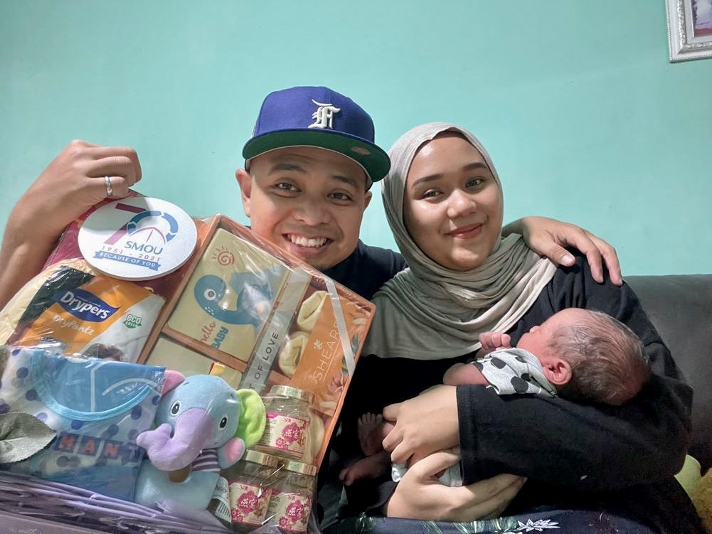 Raja Muhd Asyraf Bin Raja Muhd Amiruddin (left), SMOU member of 9 years